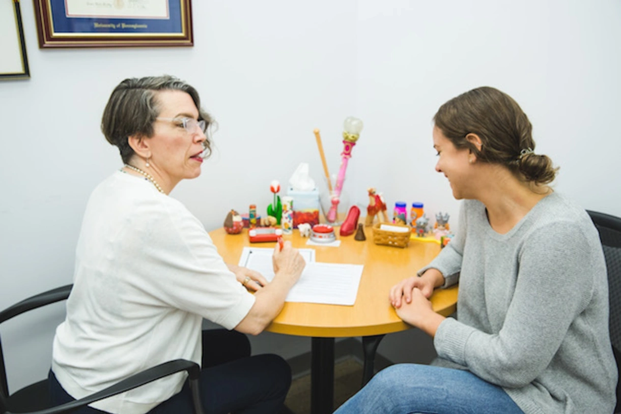 Penn GSE director of Career and Professional Development Amy Benedict, left, meets with a student in 2019 to discuss career planning
