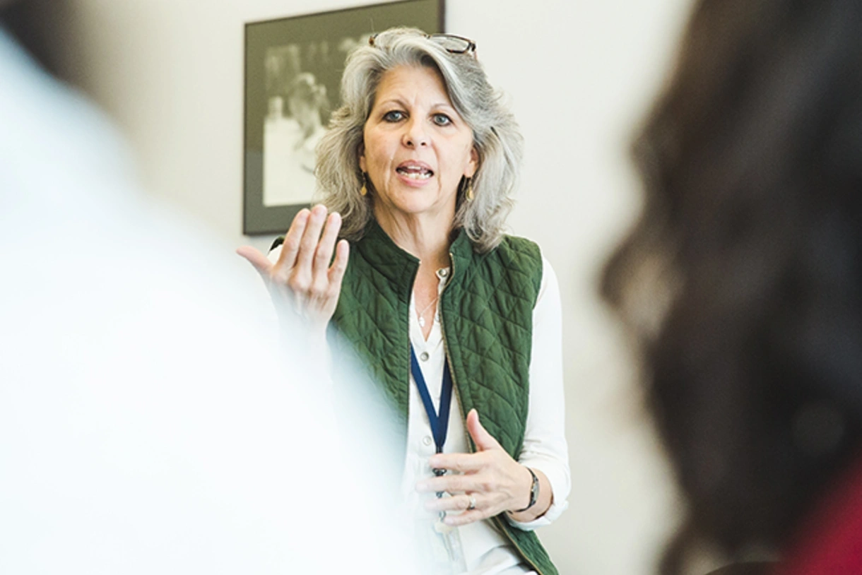 Caroline Watts speaks at a panel event about mental health in student populations.