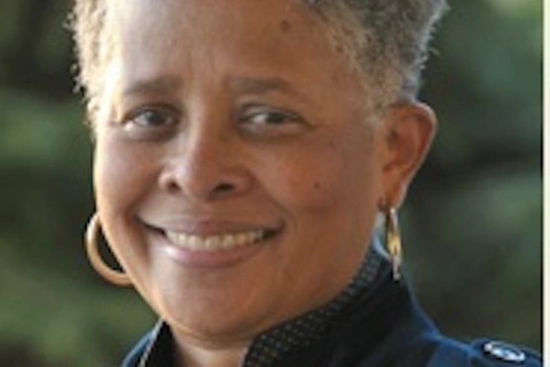 Headshot of Carol Lee aganst a nature background