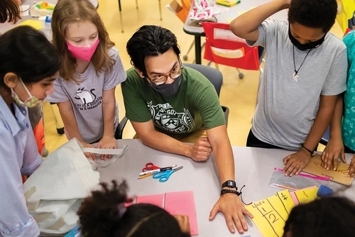 Penn GSE student teaching a group of elementary school children