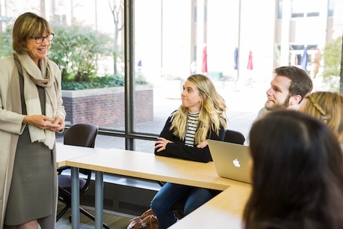 Penn GSE Dean Pam Grossman talks with students in her class.