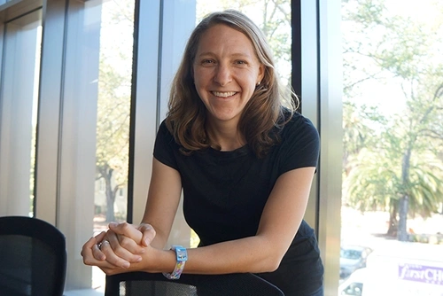 Rachel Baker smiling in front of a window