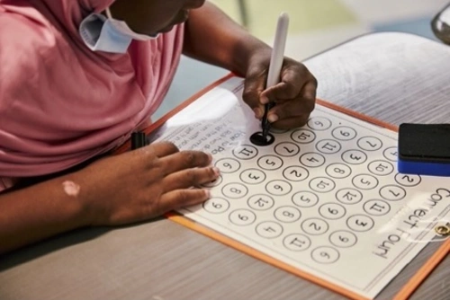 A student does RMT lessons at in Nicole Mitchell’s class at Hamilton Elementary in the summer.
