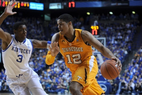 Tobias Harris, left, dribbles a basketball in a 2011 game against the University of Kentucky.