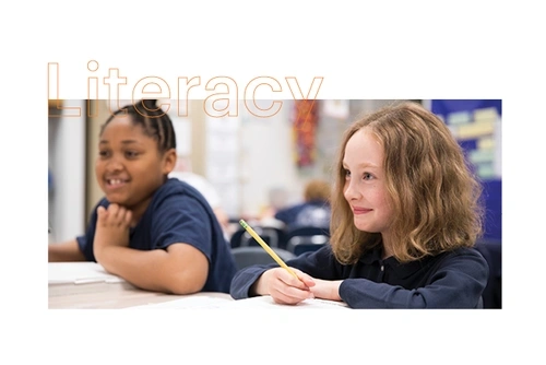 Two elementary school students learning at a desk