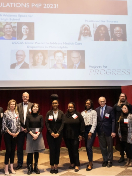 Ariane Thomas (center) and the Positioned for Success project team receiving 2023 Projects for Progress Award.