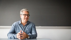 Gerald Campano sitting at table