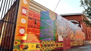 Building with mural painted on exterior wall