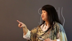Susan Yoon in front of blackboard