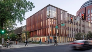 Street view of the University of Pennsylvania Graduate School of Education (Penn GSE) building, located at the corner of Walnut and 37th Streets, with pedestrians and vehicles passing by.